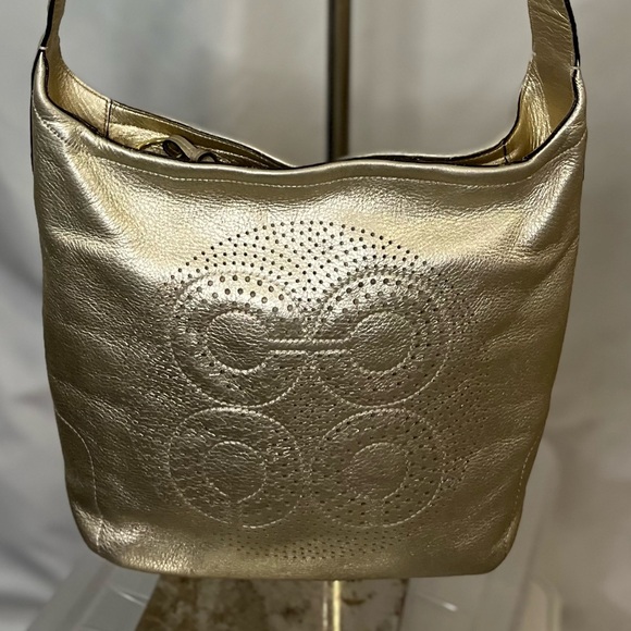 Coach Handbags - Coach gold crossbody bag.  Adjustable strap.